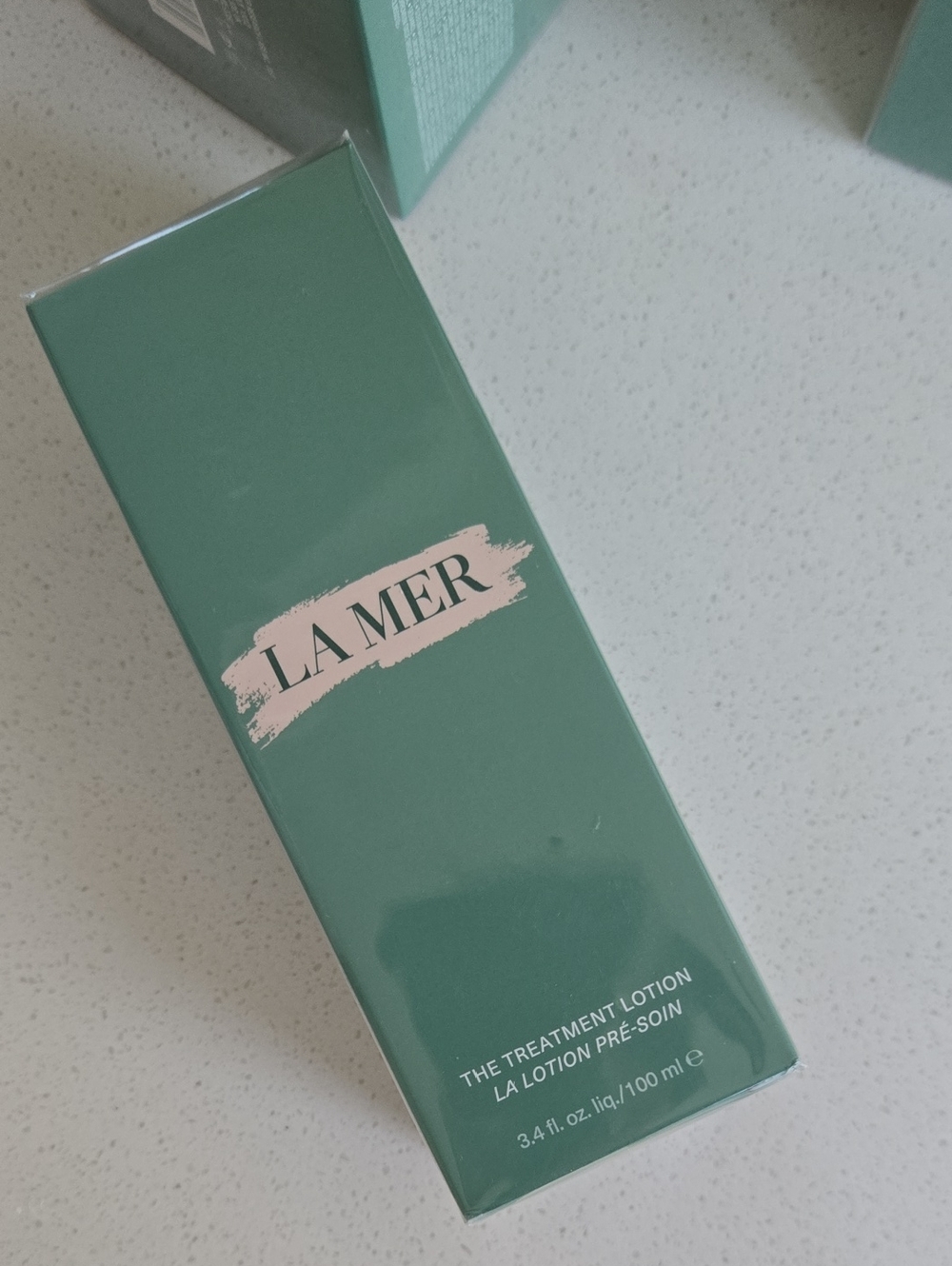 La Mer Treatment Lotion in Teal Green Packaging